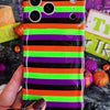 Video of the Main Witch Energy Wavy Luxe MagSafe iPhone case turning in hand to show the black, purple, green and orange stripes and the wavy edge.