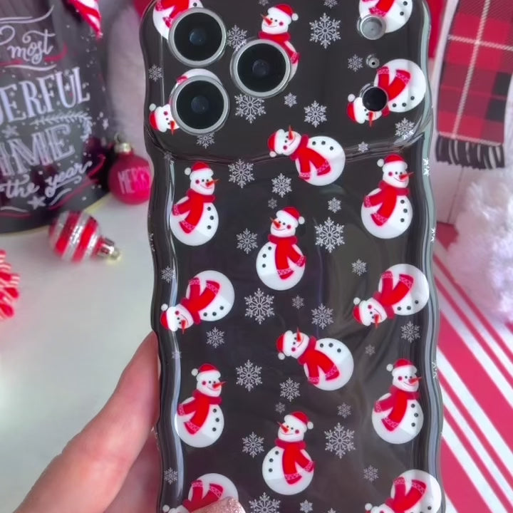 Video: close-up of the Snowman Wavy Luxe MagSafe iPhone case in hand showing the glossy black snowman print and wavy edges