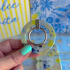 La Dolce Summer MagSafe phone grip ring with Mediterranean lemon, blueberry, blue gingham, and coastal travel lifestyle collage pattern compatible with iPhone and Samsung
