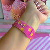 Video of the Caramel Coated Cutie Apple Watch band showing the rose-pink silicone and golden caramel apple print from every angle.