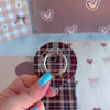 Toffee Tartan Hold It Fancy MagSafe grip ring with a brown, tan and cream tartan plaid print from Fancy Bands
