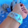 Video: Snow Pretty In Blue Apple Watch band worn on the wrist, then both bow and snowflake straps shown on a jewelry box