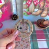 Video: the Boot Scootin' Christmas matching set, grip ring snapped onto the case, scrunchie worn on the wrist and the phone hanging from the strap