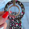 Video: the Jolly Wrist-mas matching set, grip ring snapped onto the case, scrunchie worn on the wrist and the phone hanging from the strap