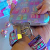 Video: No Peeking, Darling scrunchie wrist strap worn on the wrist with the matching iPhone case hanging from the clasp