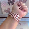 Video of the Sweet Espresso Stripes Apple Watch band showing the espresso brown and cream striped silicone from every angle.