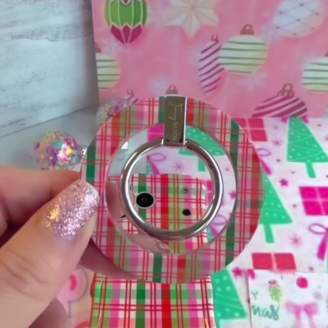 Video: snapping the Merry Little Plaid MagSafe grip ring onto the matching case and using the silver ring as a finger grip