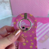 Video of the Caramel Coated Cutie MagSafe grip ring showing the pink caramel apple print and the 180 degree rotating metal ring in motion.