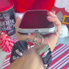 Video: wearing the Snowman scrunchie phone wrist strap on the wrist with an iPhone clipped on