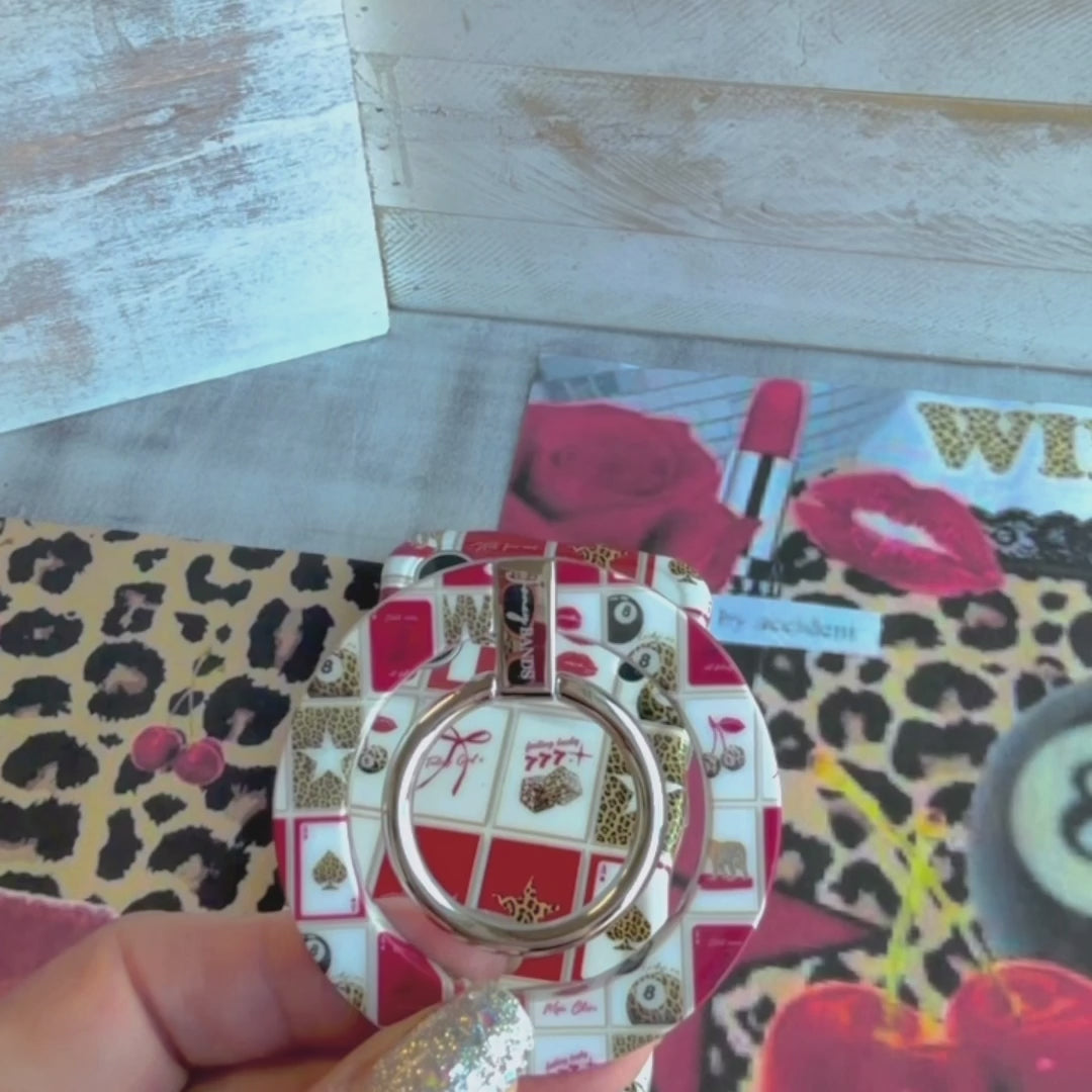 Wild Cherry collage pattern MagSafe phone grip ring with leopard print cherries, 8-balls, and playing cards on a red and white background