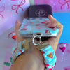 Video: Holiday Spirits, Please? scrunchie wrist strap worn on the wrist with the matching iPhone case hanging from the clasp