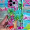 Trendy wavy iPhone case featuring a vibrant tropical resort scene with pink villas and green palm trees with a high-gloss finish.