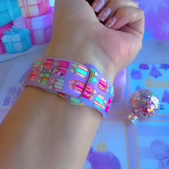 Video: No Peeking, Darling Apple Watch band worn on the wrist, then both pastel present straps shown on a pink jewelry box