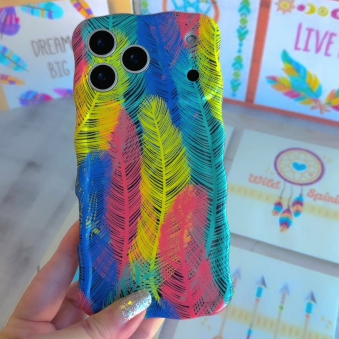 Trendy wavy iPhone case featuring a vibrant layered feather pattern in teal, orange, yellow, and blue with a high-gloss finish.