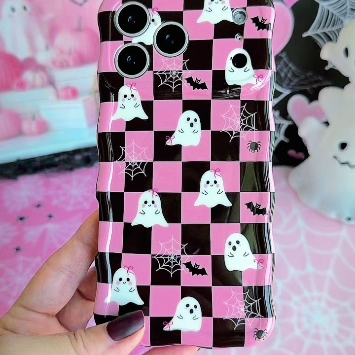 Video turning the Hey Boo, Looking Cute Wavy Luxe MagSafe iPhone case in hand, showing the pink and black checkerboard ghost print and the sculpted wavy edges.