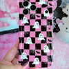 Video turning the Hey Boo, Looking Cute Wavy Luxe MagSafe iPhone case in hand, showing the pink and black checkerboard ghost print and the sculpted wavy edges.