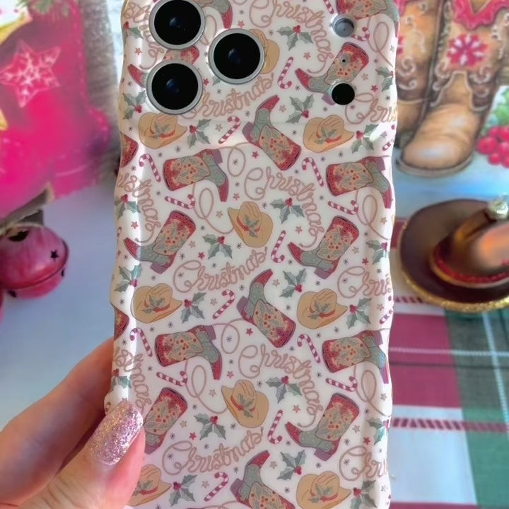 Video: turning the Boot Scootin' Christmas Wavy Luxe iPhone case in hand to show the cowboy boot print and glossy wavy edges