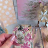 Video: Champagne Snowfall grip ring snapped onto the matching case, then held with one finger through the silver ring