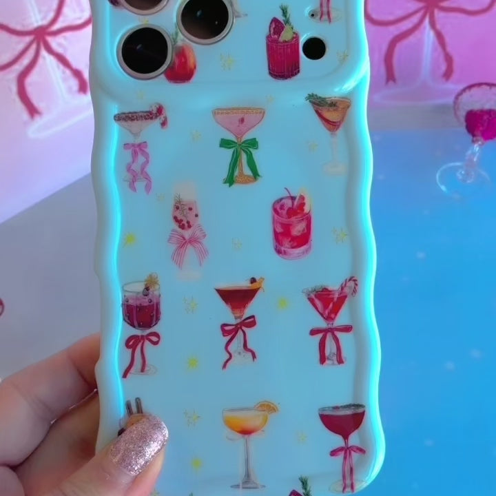 Video: turning the Holiday Spirits, Please? Wavy Luxe iPhone case in hand to show the cocktail print and glossy wavy edges
