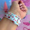 Video: Holiday Spirits, Please? Apple Watch band worn on the wrist, then both Christmas cocktail straps shown on a jewelry box