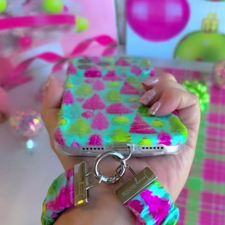 Video: Merry & Bright, Totally! scrunchie wrist strap worn on the wrist with the matching iPhone case hanging from the clasp