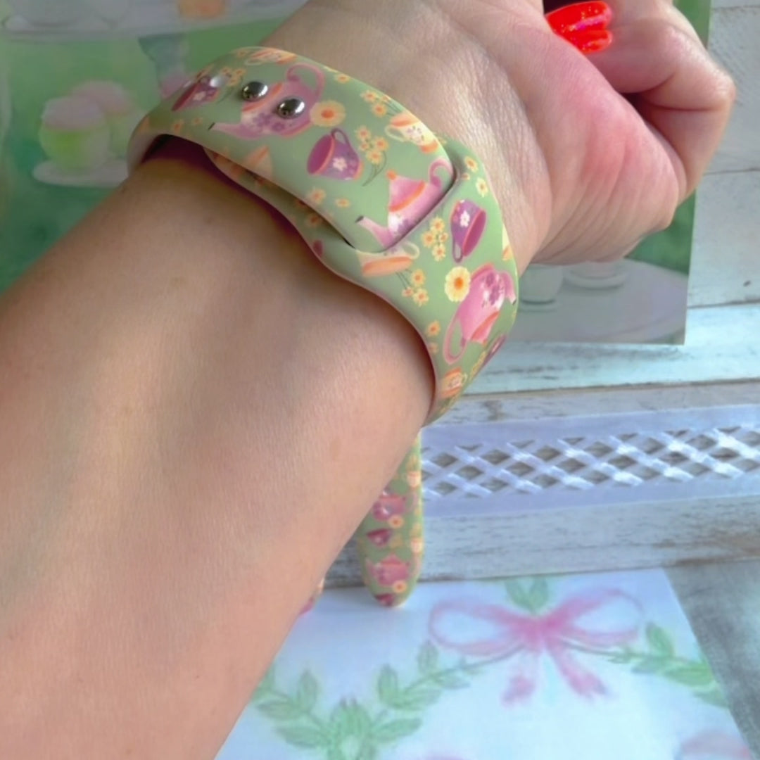 Tea Time Delight Apple Watch band with pink teapots and teacups on yellow-green background with watercolor tea party backdrop
