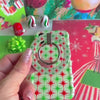 Video: Tinsel & Stardust iPhone case with the matching grip ring, then the matching scrunchie wrist strap clipped on and worn on the wrist