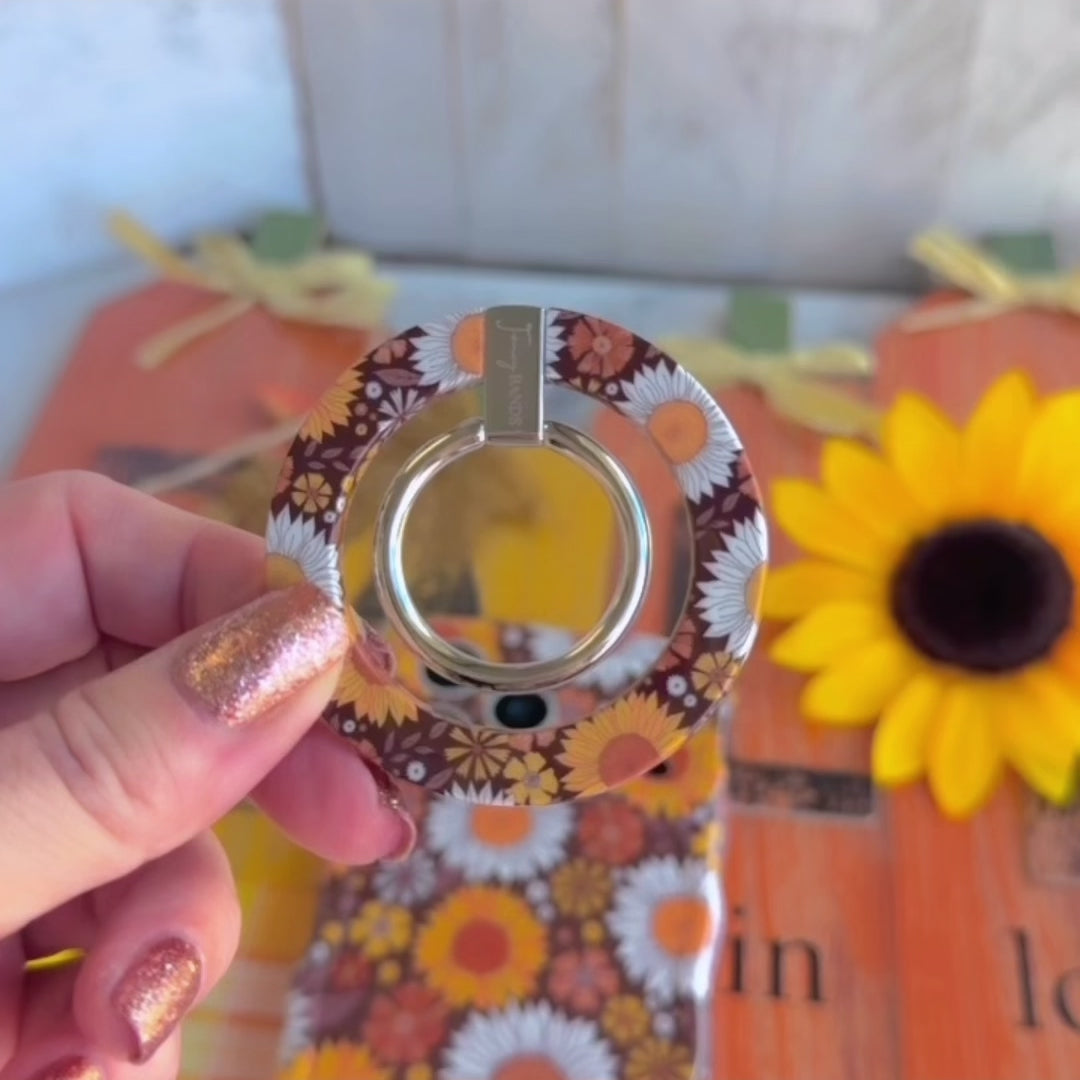 Video of the Harvest Sunflowers MagSafe grip ring showing the retro brown sunflower print and the 180 degree rotating metal ring in motion.