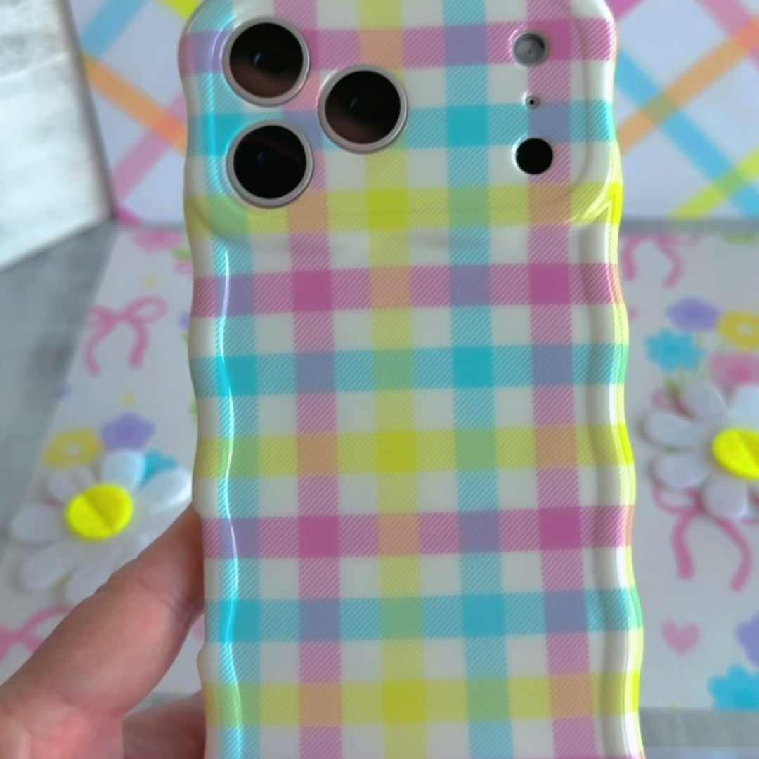Wavy iPhone case featuring a multi-colored pastel gingham pattern in pink, yellow, green, and blue.