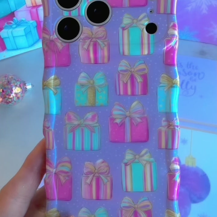 Video: turning the No Peeking, Darling Wavy Luxe iPhone case in hand to show the glossy wavy edges and pastel present print
