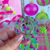 Video: Merry & Bright, Totally! grip ring shown close up, then snapped onto the matching case and held with one finger through the silver ring