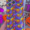 Video of the Jack-O-Lantern Jive Wavy Luxe MagSafe iPhone case turning in hand to show the violet neon pumpkin print and the sculpted wavy edge.