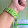 Green gingham Apple Watch band with bow detail on silicone strap