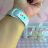 Video of the Autumn Breeze silicone Apple Watch band worn on the wrist and shown in both sizes, dusty blue with blush maple leaves and coral wheat.