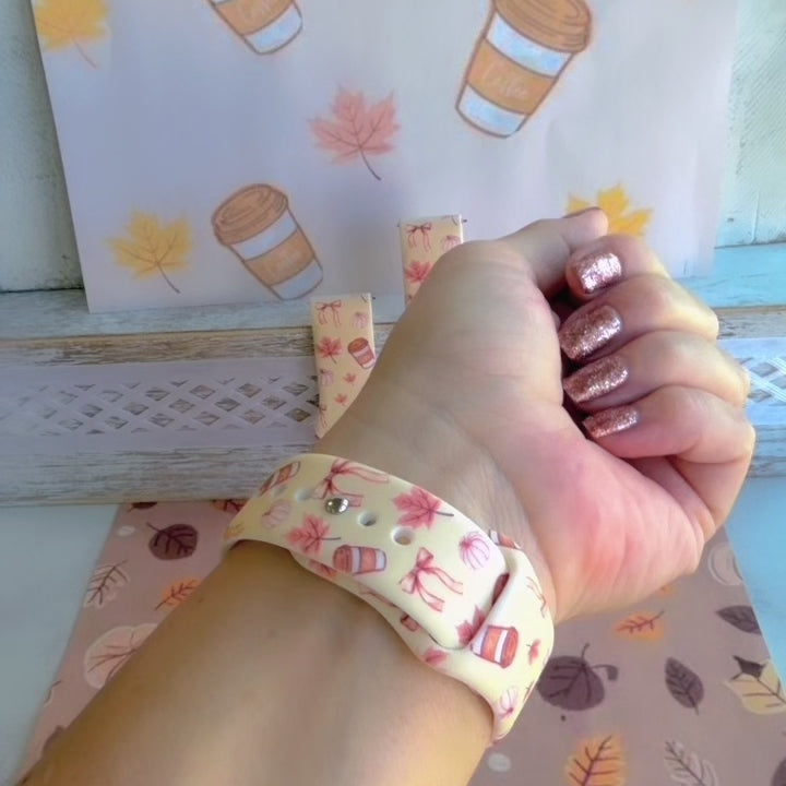Video of the Falling in Love a Latte silicone Samsung Galaxy Watch band worn on the wrist with a round Samsung watch and shown in both sizes, cream coffee print.
