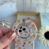 Video of the Fall Floral Bliss MagSafe grip ring showing the cream watercolor autumn floral print and the 180 degree rotating metal ring in motion.