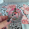 Flower-fetti Leopard pattern MagSafe phone grip ring with pink and orange flowers over black and white leopard spots compatible with iPhone and Samsung