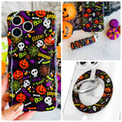 Spooky iPhone Matching Set: hand-held black Halloween MagSafe case with pumpkins and skulls, matching scrunchie wrist strap, and MagSafe grip ring